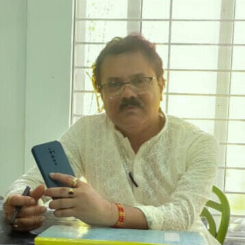 a man wearing glasses and a black shirt